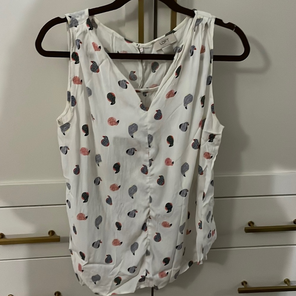 White tank with birds
